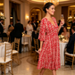 Rochie lungă în stil boem, cu imprimeu, decolteu în V și nod la talie