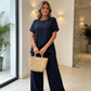 💃 Costum pentru femei: Bluză asimetrică casual și pantaloni cu picior larg – Lejer, confortabil și elegant fără efort ✨🌿