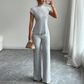Set din două piese: bluză elegantă cu guler înalt și pantaloni cu croi larg