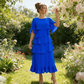 Rochie elegantă cu mâneci în valuri