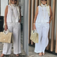 Costum simplu și respirabil pentru femei – bluză fără mâneci cu guler rotund și pantaloni cu croi larg