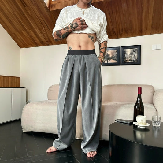 Pantaloni bărbătești cu pliuri și croi larg, cu talie elastică