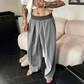 Pantaloni bărbătești cu pliuri și croi larg, cu talie elastică