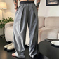 Pantaloni bărbătești cu pliuri și croi larg, cu talie elastică