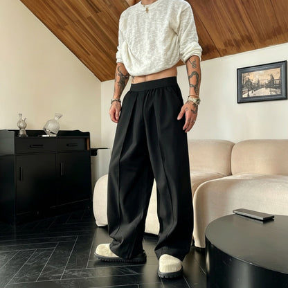 Pantaloni bărbătești cu pliuri și croi larg, cu talie elastică