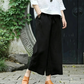 Pantaloni casual, cu croială largă și șnur, prevăzuți cu buzunare