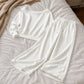 Sett med avslappet off-shoulder-top og bukser med vide ben for damer